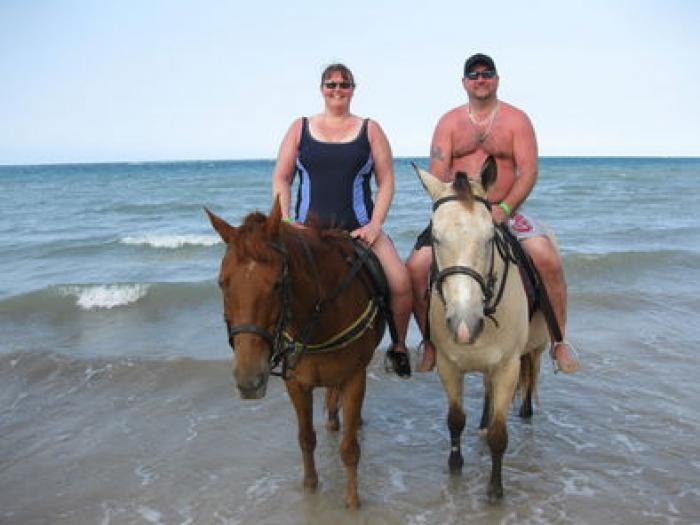 Horseback riding on the beach, a tour attraction in Cape Town, South Africa