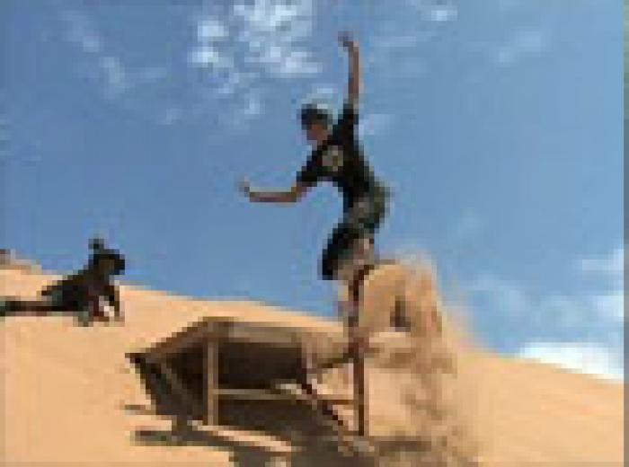 Sandboarding at Mount Mayhem, a tour attraction in EGoli iNingizimu Afrika